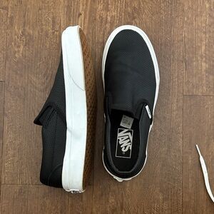 Vans women’s Black and White Slip-On Sneakers